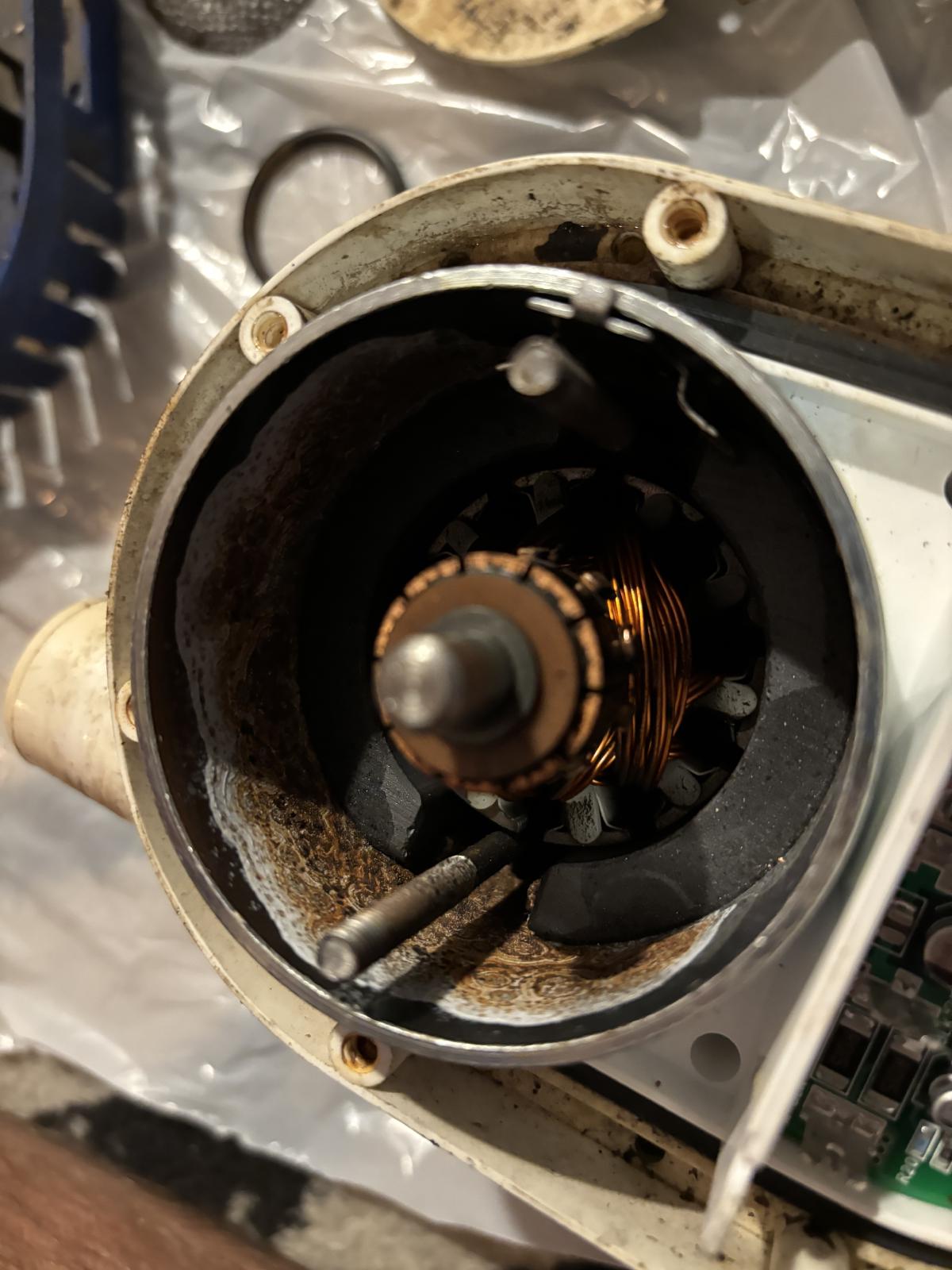 Inside of the motor with corrosion in the bottom