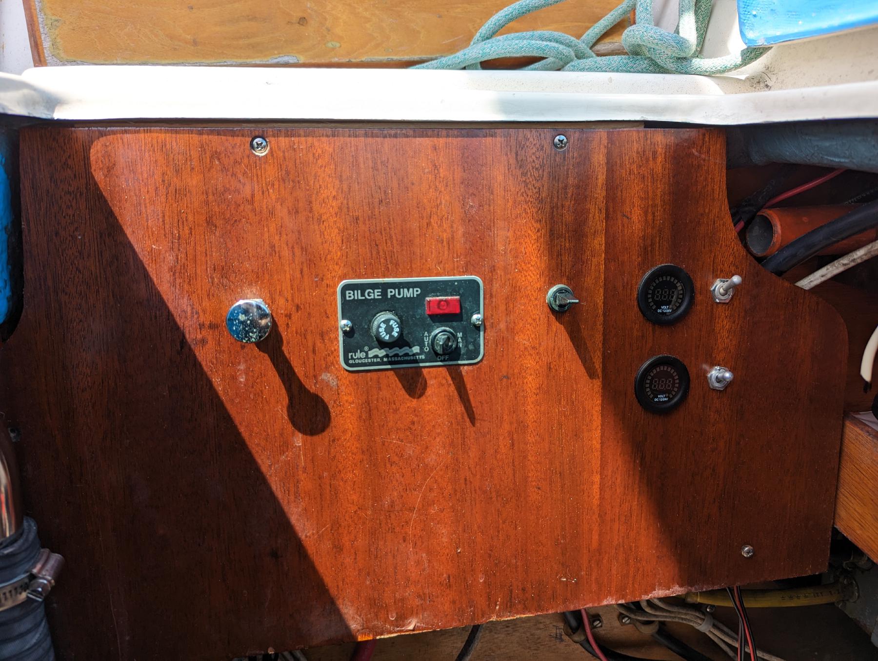 Starboard cockpit locker panel before correcting the battery switches. The blower switch on the left and the black switch towards the right are not connected to anything.